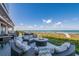 Outdoor patio featuring a fire pit, comfortable seating, and stunning ocean views, perfect for relaxation at 5000 Gasparilla Rd # Vh37, Boca Grande, FL 33921