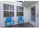 Cozy front porch with two chairs and a decorative rug, creating a welcoming entrance at 5000 Gasparilla Rd # Vh37, Boca Grande, FL 33921