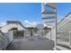 Relax on the rooftop deck featuring white spiral staircase and chairs offering a perfect outdoor living space at 5000 Gasparilla Rd # Vh37, Boca Grande, FL 33921