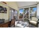 Bright sunroom with large windows offering beautiful views and comfortable seating, creating a serene relaxation space at 5000 Gasparilla Rd # Vh37, Boca Grande, FL 33921