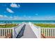 Charming beach walkway leading to the ocean, surrounded by lush greenery and beautiful coastal scenery at 5000 Gasparilla Rd # Vh37, Boca Grande, FL 33921