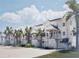 Charming white townhomes feature covered entrances, lush tropical landscaping and ample parking at 5800 Gulf Shores Dr # 33, Boca Grande, FL 33921
