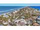 Breathtaking aerial view of homes along the coastline with ocean and bay views at 6035 Manasota Key Rd, Englewood, FL 34223