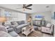 Beautiful living room with a large window, comfortable seating, and beach decor at 6035 Manasota Key Rd, Englewood, FL 34223