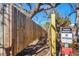 Wooden fence line bordering a property with posted No Trespassing signs and beach access restrictions at 6035 Manasota Key Rd, Englewood, FL 34223