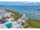 Amazing aerial view of the community showcasing a pool, hot tub, and docks extending into the bay at 6040 Boca Grande Cswy # A2, Boca Grande, FL 33921