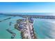 Expansive aerial shot of the coastal condos with private docks, highlighting the idyllic waterfront living experience at 6040 Boca Grande Cswy # A2, Boca Grande, FL 33921