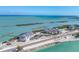 An attractive coastal complex from above, boasting waterfront residences, boat docks, and a clear view of the ocean at 6040 Boca Grande Cswy # A2, Boca Grande, FL 33921