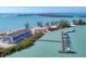 Spectacular aerial view of waterfront condos with private boat docks, embodying the ultimate coastal lifestyle at 6040 Boca Grande Cswy # A2, Boca Grande, FL 33921