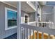 Cozy balcony with railing view of the coastal landscape and architectural details of the residences at 6040 Boca Grande Cswy # A2, Boca Grande, FL 33921