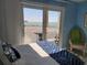 A bedroom view offers a gorgeous waterfront scene, an open-air balcony, and comfortable outdoor seating at 6040 Boca Grande Cswy # A2, Boca Grande, FL 33921