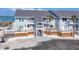 Coastal condos with outdoor living spaces, showing a well-kept exterior with water views in the background at 6040 Boca Grande Cswy # A2, Boca Grande, FL 33921