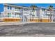 Exterior of waterfront condominiums displaying architectural details and access to outdoor balconies and parking at 6040 Boca Grande Cswy # A2, Boca Grande, FL 33921