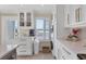 Well-lit laundry area featuring cabinets and modern appliances at 6040 Boca Grande Cswy # A2, Boca Grande, FL 33921
