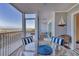 Inviting screened patio featuring cozy wicker furniture and beautiful views, perfect for serene outdoor relaxation at 6040 Boca Grande Cswy # A2, Boca Grande, FL 33921