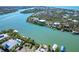 Stunning aerial view of waterfront property with dock and easy access to water at 62 Tarpon Way, Placida, FL 33946