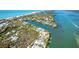 Waterfront home with lush landscaping, and stunning views of the surrounding coastal community at 62 Tarpon Way, Placida, FL 33946