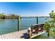 Scenic wooden dock overlooks calm waters, providing a peaceful space to enjoy the scenery at 62 Tarpon Way, Placida, FL 33946