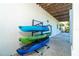 Outdoor view of colorful kayaks stored on a rack near the home, perfect for waterfront adventures at 62 Tarpon Way, Placida, FL 33946