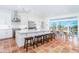 Spacious kitchen with a large island, stainless steel appliances, and ample seating for dining at 62 Tarpon Way, Placida, FL 33946