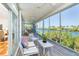 Relaxing screened-in porch with seating, overlooking beautiful water views at 62 Tarpon Way, Placida, FL 33946
