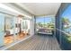 Beautiful screened-in porch with a plush sofa and waterfront views at 62 Tarpon Way, Placida, FL 33946