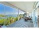 Inviting porch with comfortable seating and scenic waterfront panorama at 62 Tarpon Way, Placida, FL 33946