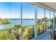 Enjoy breathtaking views from this expansive screened-in porch with relaxing seating at 62 Tarpon Way, Placida, FL 33946