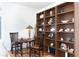 Office area featuring built-in shelving, decorative items and chess table with chairs at 62 Tarpon Way, Placida, FL 33946