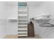 Spacious walk-in closet featuring wire shelving and a built-in storage tower at 632 Boundary Blvd, Rotonda West, FL 33947