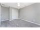 Bedroom with closet, wood-look tile flooring, and a ceiling fan at 6602 David Blvd, Port Charlotte, FL 33981