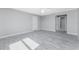 Bright bedroom with wood-look tile flooring and multiple closets at 6602 David Blvd, Port Charlotte, FL 33981
