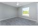 Bedroom features natural light, a ceiling fan, and neutral paint at 6602 David Blvd, Port Charlotte, FL 33981