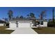 Charming single-story home featuring a three-car garage, well-maintained landscaping, and a classic design at 6602 David Blvd, Port Charlotte, FL 33981