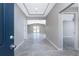 Inviting foyer with elegant tray ceiling, stylish gray wood-look floors, and an open, airy feel at 6602 David Blvd, Port Charlotte, FL 33981