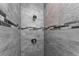 Detailed shower with wood-look tile and decorative border at 6602 David Blvd, Port Charlotte, FL 33981