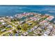 Scenic aerial view capturing a vibrant waterfront community with beautiful homes along winding canals at 698 & West W Perry St, Englewood, FL 34223