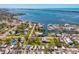 Expansive aerial view showcasing a waterfront property nestled in a charming coastal neighborhood at 698 & West W Perry St, Englewood, FL 34223