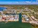 Stunning aerial view of waterfront homes with private docks on canals leading to open water at 698 & West W Perry St, Englewood, FL 34223