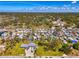 Aerial view of a home with a long drive and mature landscaping in a waterside community at 698 & West W Perry St, Englewood, FL 34223
