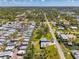 Birds-eye view of a serene community with well-maintained homes and mature landscaping at 698 & West W Perry St, Englewood, FL 34223