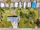 Aerial view of property with lush lawn, mature trees, RV parking and convenient street access at 698 & West W Perry St, Englewood, FL 34223