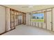 Bedroom featuring a bright window and framed walls at 698 & West W Perry St, Englewood, FL 34223