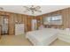 Spacious bedroom with natural lighting and wood paneled walls at 698 & West W Perry St, Englewood, FL 34223
