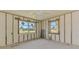 Bedroom showcasing two bright windows and framed walls at 698 & West W Perry St, Englewood, FL 34223