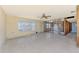 Bright, spacious living room with lattice windows, offering great renovation potential at 698 & West W Perry St, Englewood, FL 34223