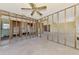 Spacious living room with ceiling fan and framed walls at 698 & West W Perry St, Englewood, FL 34223