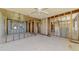 Spacious living room featuring natural light, ceiling fan, and framed walls at 698 & West W Perry St, Englewood, FL 34223