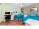 Bedroom featuring a desk, two twin beds, and a large window to brighten the space at 7019 Janette St, Englewood, FL 34224