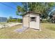 The backyard features a functional storage shed with a ramp, offering convenient access and storage solutions at 7019 Janette St, Englewood, FL 34224